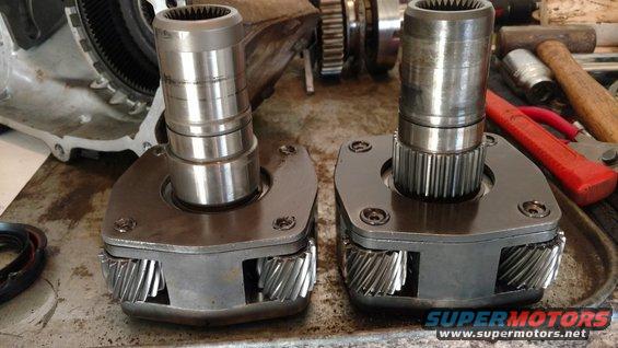 Two metal transfer case components with gears visible