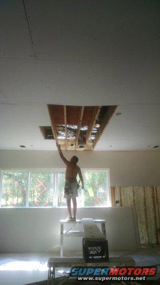 img_20160916_151325985.jpg The framer crowned one celing joist down, and the sheetrock boss told the crew to sheet it for some reason. So now, it's coming down so the framer can fix it. Entry looking southwest through living room.