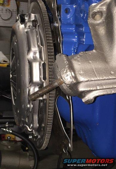 Clutch and flywheel assembly on blue engine block