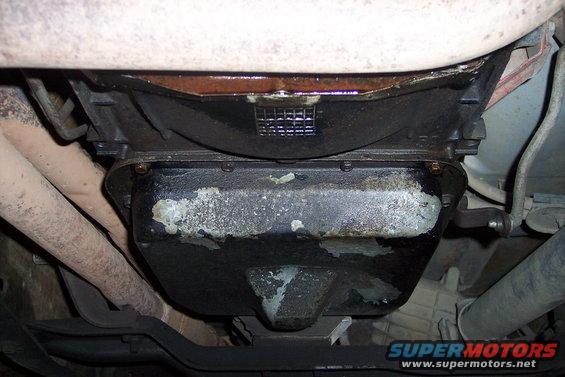 underside of vehicle showing oil pan and exhaust pipes