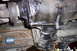 1990 Ford Bronco - Close-up of the vehicle's transmission and driveshaft, showing signs of wear and oil leakage.