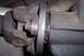 1990 Ford Bronco - Close-up view of a vehicle's driveshaft U-joint and differential flange, with a Supermotors.net watermark visible.