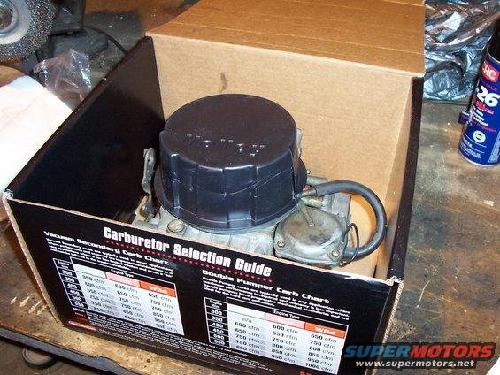 Carburetor in an open box with a selection guide on the inside flap