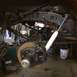 1962 Chevrolet Suburban - A detailed view of a vehicle's rear suspension system, showing components like leaf springs and a shock absorber.