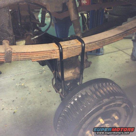 close-up of leaf springs and rear axle on a vehicle
