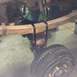 1962 Chevrolet Suburban - The rear suspension of a vehicle, showing leaf springs and a drum brake assembly.
