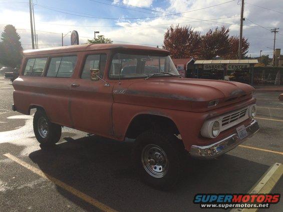1962 Chevrolet Suburban, red paint, some rust spots, aftermarket wheels