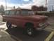 1962 Chevrolet Suburban - This 1962 Chevrolet Suburban is parked in a lot, showing its distinctive grille and body style.