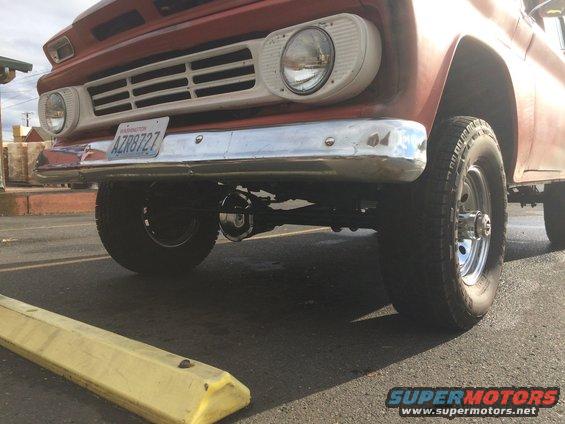 Red truck front end with chrome bumper and grille, Washington license plate AZR8727