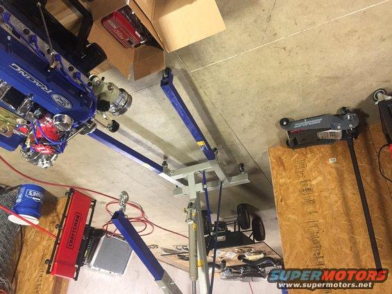 Blue Ford Racing engine on engine hoist
