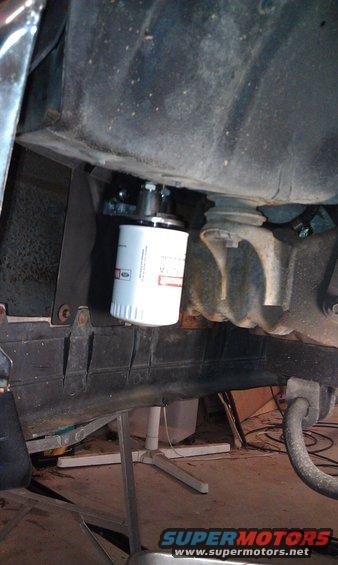 Aux transmission filter, left front fender area.