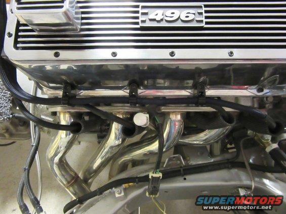 Chrome engine with 496 valve cover and exhaust headers