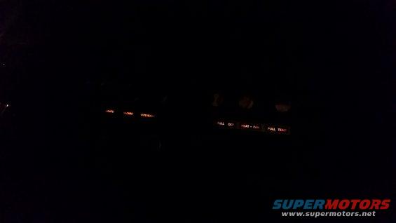 dashboard lights on, showing 'full def', 'heat - fan', and 'full temp' labels