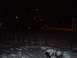 1998 Ford Expedition - A dark, snowy night scene with lights visible in the background.
