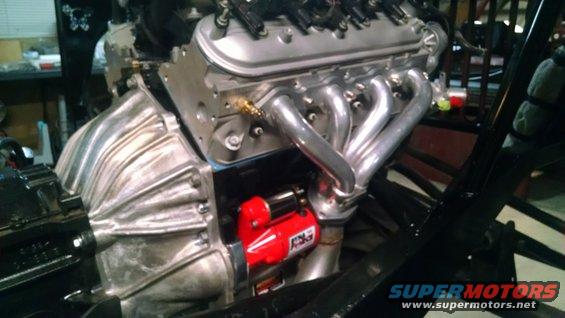 Chrome exhaust headers with red gasket material