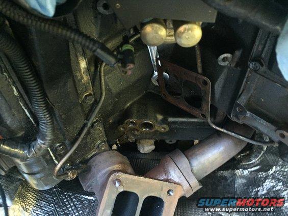 Engine exhaust manifold gasket removed from a vehicle