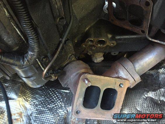 Close-up of exhaust manifold and turbo plumbing, possibly for a truck