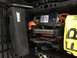 1988 Ford Bronco - Storage compartment filled with various vehicle recovery and air supply equipment.