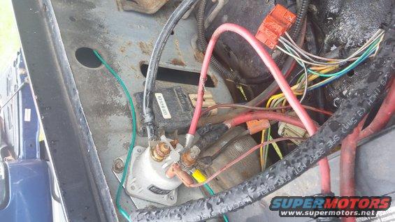 Close-up of starter solenoid and wiring harness in an engine bay