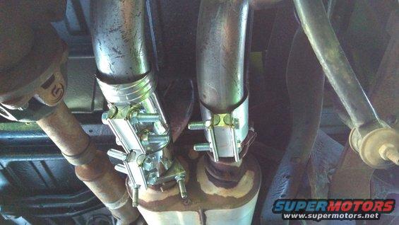 Here's my redneck install for the second pipe; ugly but it works. I have another coupler u-bolted to the muffler, then a flex pipe running to the tailpipe to create the right angle I wanted. Everything is secured with band clamps and gasket rtv once again.