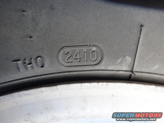 Tire tread showing DOT code 2410, indicating manufacture in the 24th week of 2010