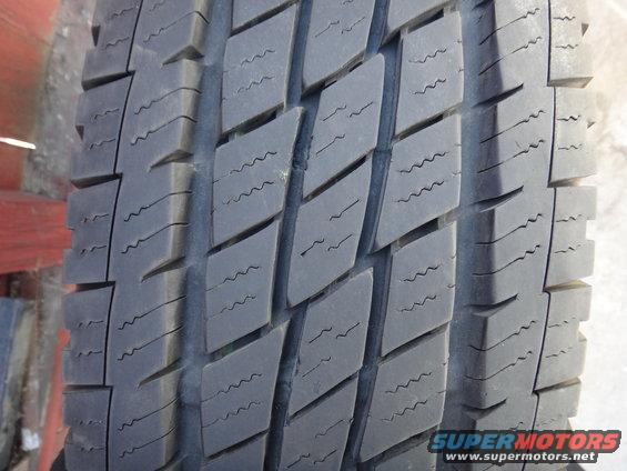 Close-up of a tire tread with diamond-shaped blocks