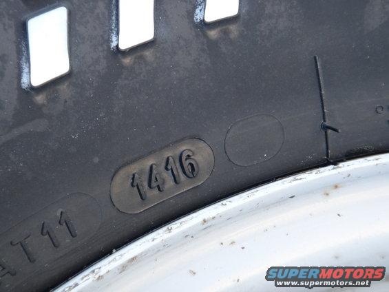 Tire sidewall showing DOT code 1416, indicating manufacture in the 14th week of 2016