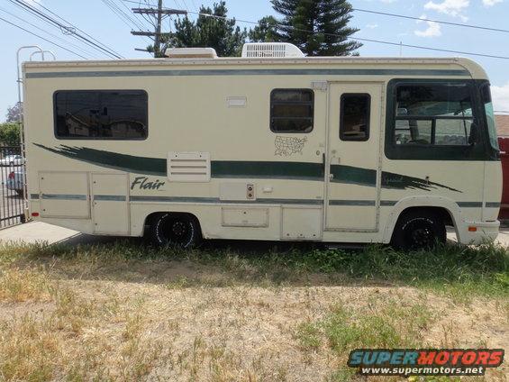 motorhome with green stripe and 'Flair' text on side