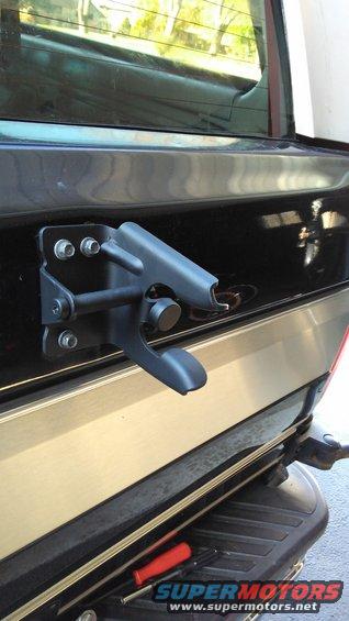 Shaved off rust and repainted the tire arm holder.