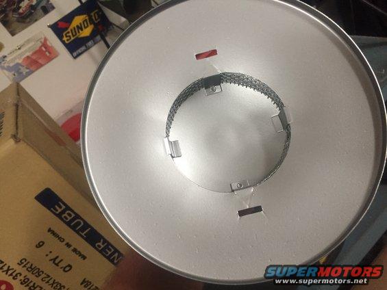 air filter with metal mesh inside, box with text 'NER TUBE' visible