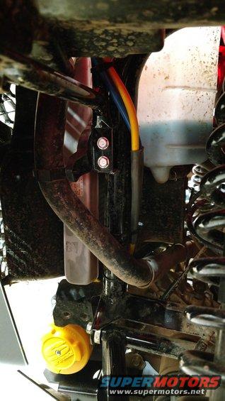 ATV winch mount with yellow cap and blue/orange cables