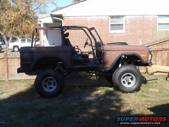 1972 Ford Bronco with roll cage, doors removed, and lifted suspension