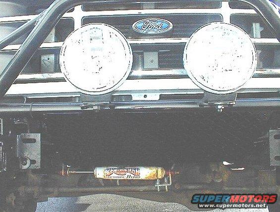 1995 Ford Bronco front grille with two round lights and a Rancho shock absorber mounted below