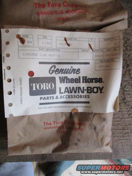 Chrome lug nut 3 part with Toro Lawn-Boy label