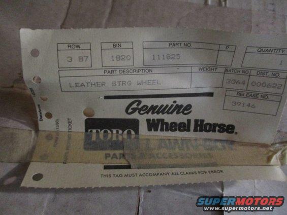Part tag for Toro Wheel Horse showing ROW 3 87, BIN 1920, PART NO. 111825, and description LEATHER STRG WHEEL
