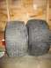 1986 Yamaha BLASTER - Two tires are shown side-by-side indoors, with a diagram on the wall behind them.