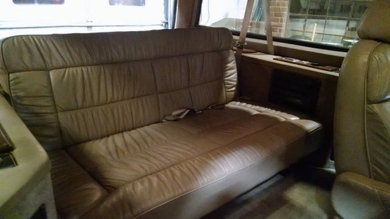 RV interior with seats and cabinets