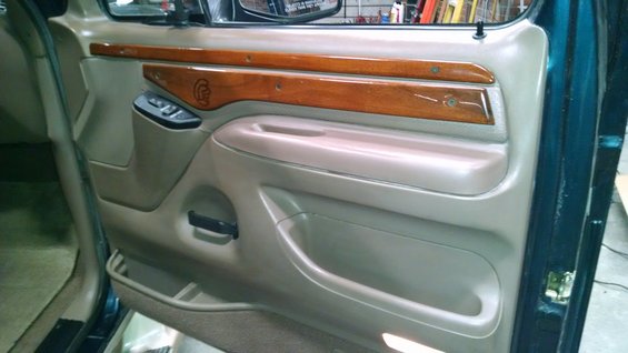 1995 Ford C-150 Centurion interior door panel with wood trim and power controls
