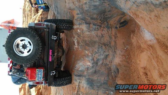 1979 Ford Bronco with spare tire and gas can on rocky trail