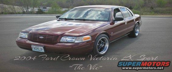 2004 Ford Crown Victoria LX Sport sedan, maroon paint, aftermarket wheels