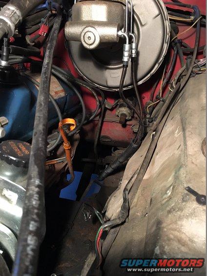 Close-up of brake master cylinder and engine bay wiring