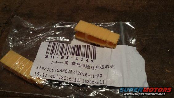 Yellow fuse puller tool with packaging label