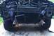 1995 Ford Bronco - The front of a disassembled SUV, likely from the 1990s, with the radiator and engine exposed.