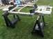 1995 Ford Bronco - Vehicle frame is supported by sawhorses on a grassy lawn.