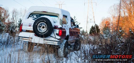 1995 Ford Bronco rear view in snow