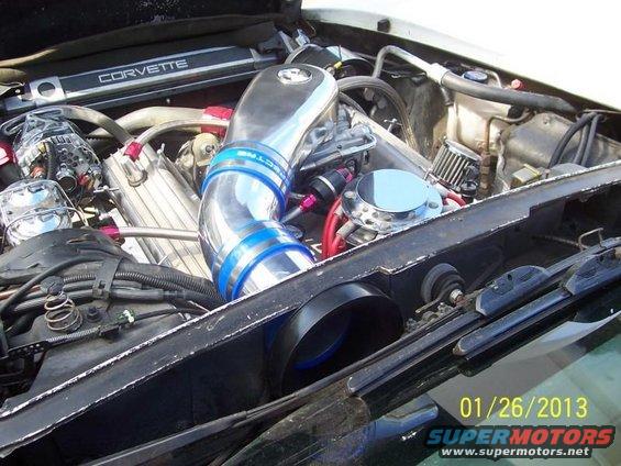 Corvette engine bay with chrome intake and visible engine components