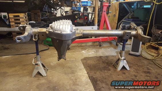 Ford Bronco rear axle assembly on jack stands in a garage
