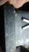 1985 Ford Bronco - Stamped part number N016 01 on a trailer hitch component. Two metal pins are also visible.