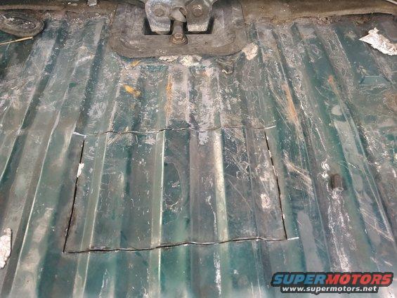 kimg0099.jpg i looked at the floor for the line of spot welds. this is where a crossmember is to hold the floor. i started cutting alittl away form the spot welds hoping to miss the crossmember. i then cut about a foot wide. i cut about 8 inches back which is enough to get the pump out but a couple more inches would make it easier.

i used a sawzaw with a blade i cut shorter to prevent hitting the tank. i tried to be extra carefull not to hit the electrical or fuel hoses. remember there is also a vent hose which i almost hit