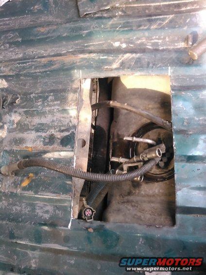 kimg0101.jpg disconnect the fuel lines and electrical.

knock the lock ring off. i had plenty of mud on the lock ring. i used a small hammer to lightly tap the top of the tank some to help free up any dirt. then i used compressed air to blow the dirt away so it wont drop in the tank